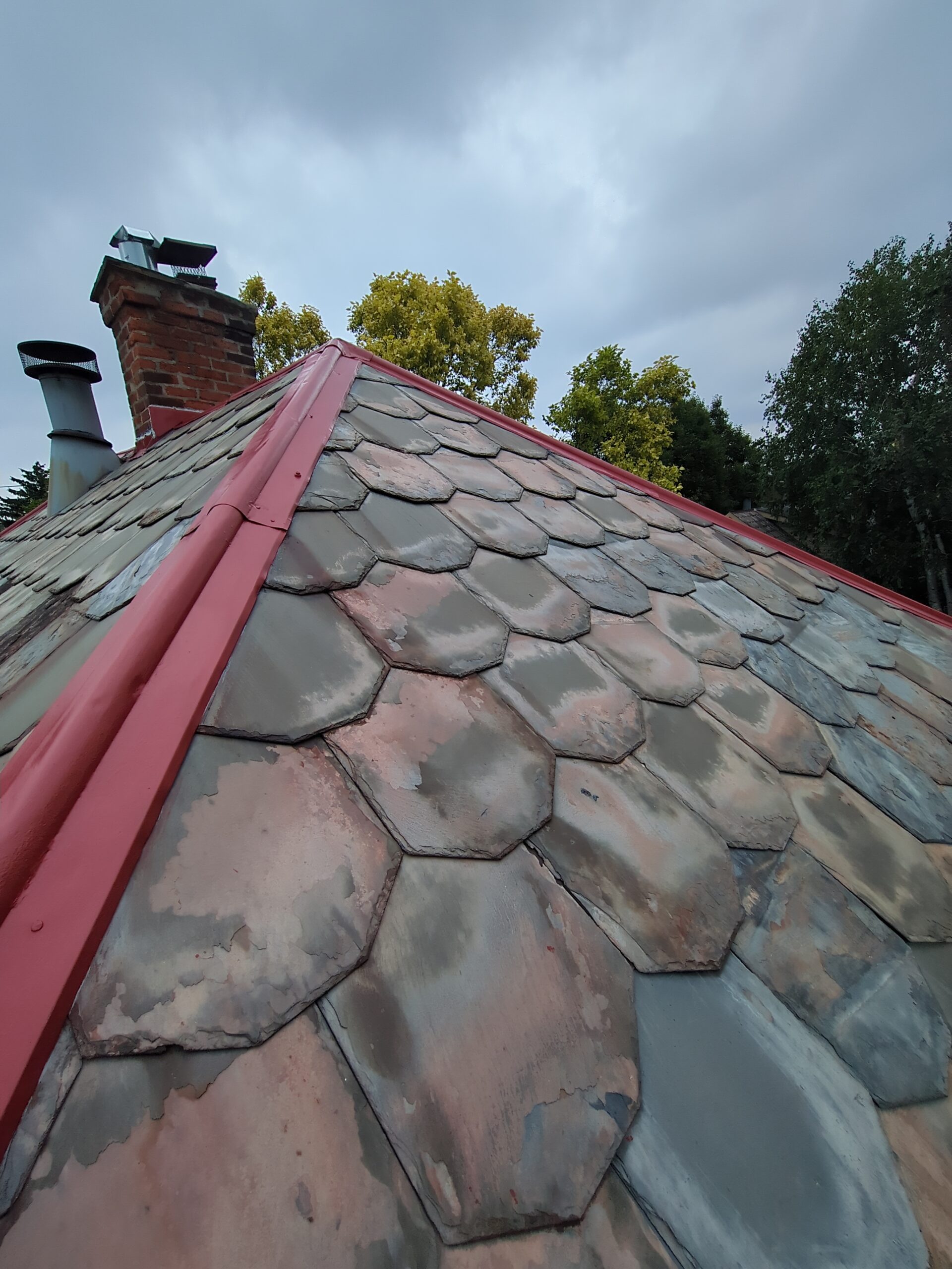 restoring painted ridge rolls on slate roof