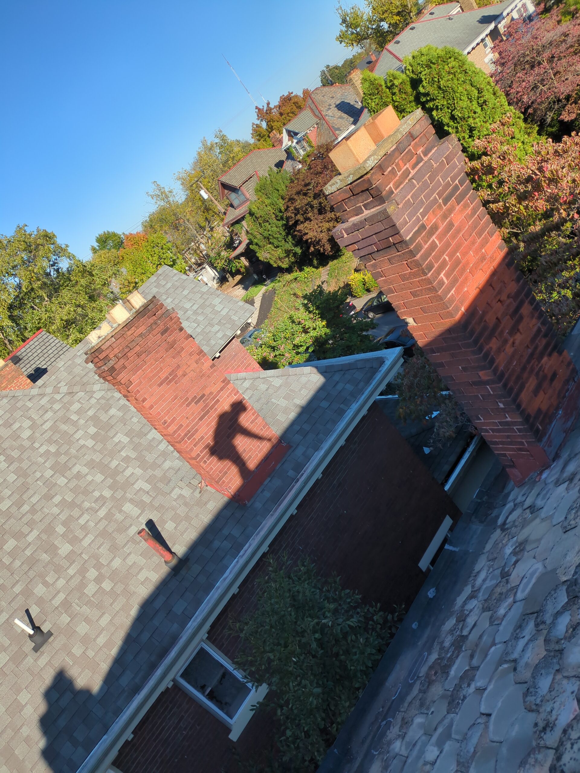 Replacing cracked slate roof tiles during repair service