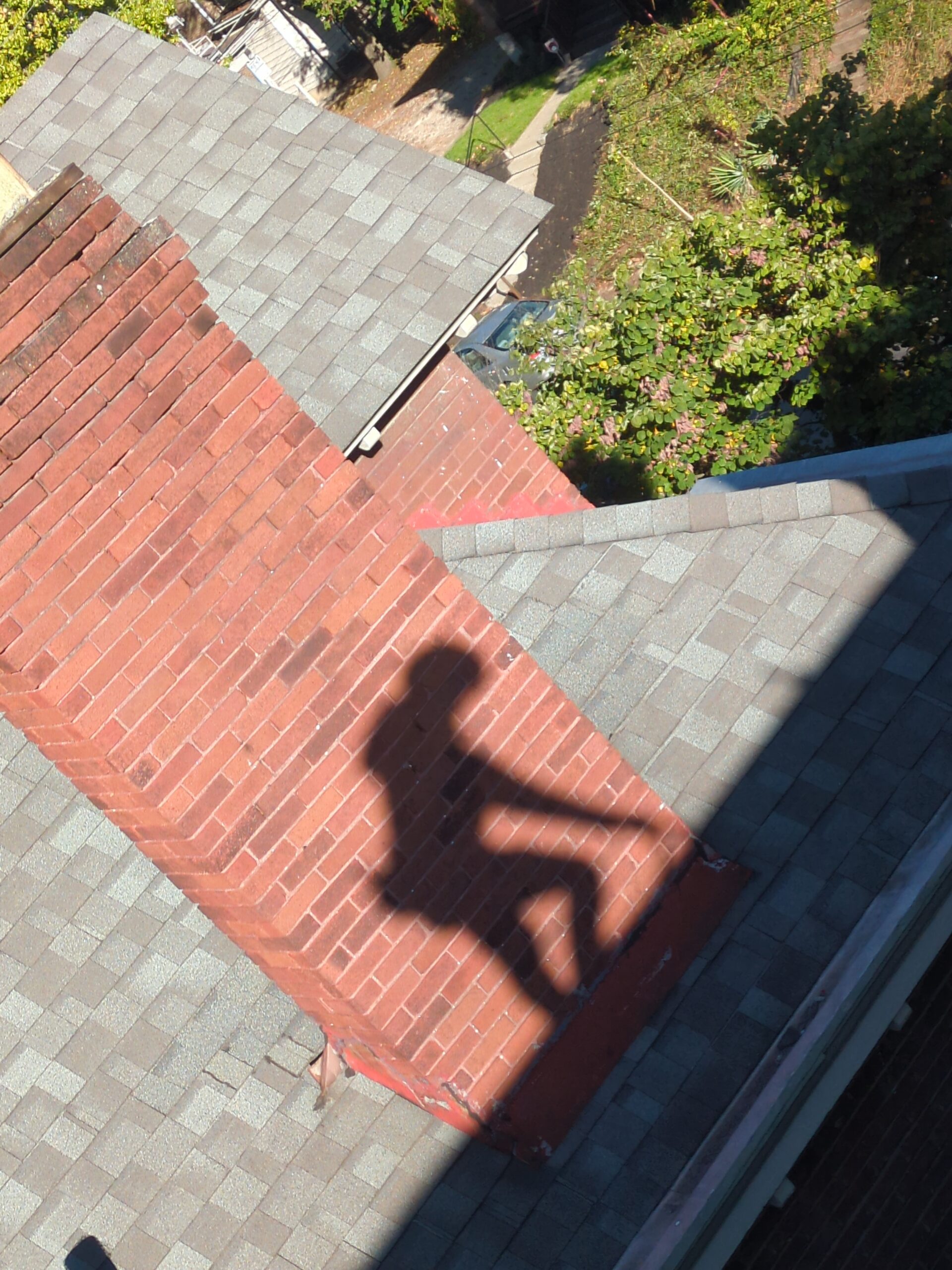 Replacing cracked slate roof tiles during repair service